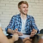 Young man smiling in job interview